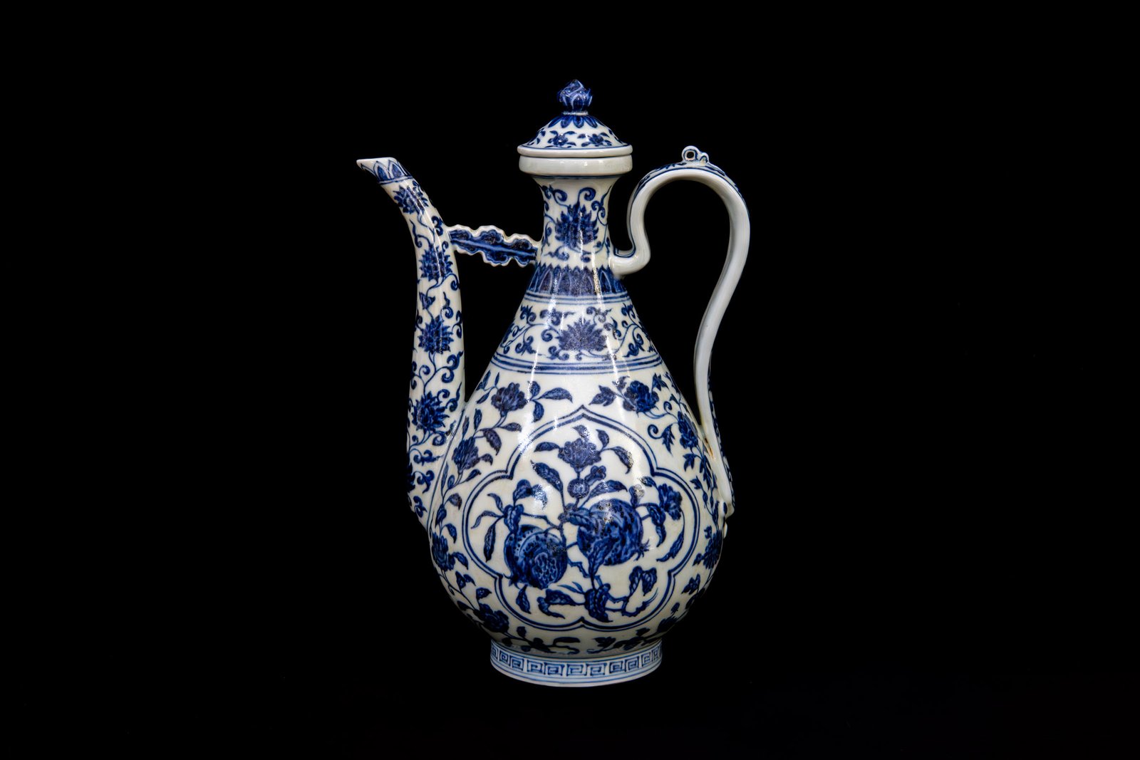 Ming Yongle blue and white ewer and cover with panels of detached floral and fruit sprays